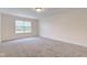 Bright bedroom featuring a large window and neutral wall and carpet colors at 8684 Captain Dr, Avon, IN 46123