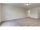 Neutral bedroom features carpeted floors, light walls, and access to bathroom at 8684 Captain Dr, Avon, IN 46123
