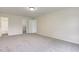 Neutral bedroom features carpeted floors, light walls, and closet and bathroom entrances at 8684 Captain Dr, Avon, IN 46123