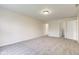 Spacious bedroom with neutral walls, carpet, and doors to bathroom and closet at 8684 Captain Dr, Avon, IN 46123