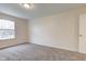 Bright bedroom featuring a large window and neutral wall and carpet colors at 8684 Captain Dr, Avon, IN 46123