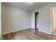 This bedroom has hard wood floors, a closet, and neutral paint at 8684 Captain Dr, Avon, IN 46123