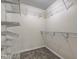 Walk-in closet featuring wire shelves and neutral walls and carpet at 8684 Captain Dr, Avon, IN 46123
