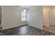 The dining room features dark, wood-look floors and a modern light fixture at 8684 Captain Dr, Avon, IN 46123