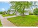 Inviting home with a brick facade, two-car garage, lush green lawn, and sidewalk at 8684 Captain Dr, Avon, IN 46123