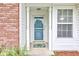 Charming home entrance with a decorative doormat, sidelight window, and white trim at 8684 Captain Dr, Avon, IN 46123