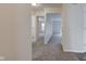 Hallway with carpet and neutral paint, leading to other rooms in the home at 8684 Captain Dr, Avon, IN 46123