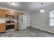 Bright kitchen featuring stainless steel appliances, wood cabinets, and stylish floors at 8684 Captain Dr, Avon, IN 46123