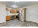 Spacious kitchen with stainless steel appliances, wood cabinets, and modern flooring at 8684 Captain Dr, Avon, IN 46123