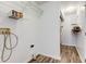 Laundry room featuring wire shelving and modern vinyl floors at 8684 Captain Dr, Avon, IN 46123
