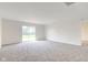 Large living room with sliding glass doors leading to outdoor space at 8684 Captain Dr, Avon, IN 46123