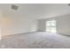 Large living room with sliding glass doors leading to outdoor space at 8684 Captain Dr, Avon, IN 46123