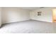 Spacious living room with neutral carpet and view into adjacent kitchen area at 8684 Captain Dr, Avon, IN 46123