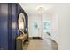 Stylish entryway features a textured blue accent wall, modern lighting, and a console table at 8684 Marietta Ln, McCordsville, IN 46055