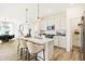 Bright kitchen featuring a large island, stainless steel appliances, and ample white cabinetry at 8684 Marietta Ln, McCordsville, IN 46055