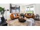 Comfortable living room featuring stylish sofas, decorative art, and abundant natural light at 8684 Marietta Ln, McCordsville, IN 46055