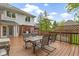 Spacious wooden back deck including an outdoor dining set with seating for four at 8723 Bergeson Dr, Indianapolis, IN 46278