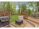 Back deck including a built-in grill and fire pit with outdoor seating for dining and entertaining at 8723 Bergeson Dr, Indianapolis, IN 46278