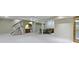 Finished basement with a dining set, wet bar, carpet, and staircase at 8723 Bergeson Dr, Indianapolis, IN 46278