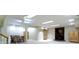 Finished basement with recessed lighting, dining set, and wood-burning fireplace at 8723 Bergeson Dr, Indianapolis, IN 46278