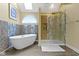 Relaxing bathroom featuring a soaking tub, a separate glass-enclosed shower, and a skylight at 8723 Bergeson Dr, Indianapolis, IN 46278