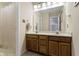 Bathroom with a double sink vanity, mirror, and shower with curtain at 8723 Bergeson Dr, Indianapolis, IN 46278