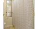 Bathroom featuring a mirror, towel rack, and shower with a floral curtain at 8723 Bergeson Dr, Indianapolis, IN 46278