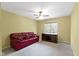 Bedroom featuring a plush couch, ceiling fan, and bright light from a window at 8723 Bergeson Dr, Indianapolis, IN 46278