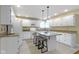 Well-lit kitchen featuring white cabinets, a center island, and modern appliances at 8723 Bergeson Dr, Indianapolis, IN 46278