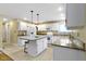Bright kitchen featuring white cabinets, a center island, and stainless steel appliances at 8723 Bergeson Dr, Indianapolis, IN 46278