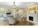 Open-concept layout with a fireplace, living room, and dining area, great for entertaining at 8723 Bergeson Dr, Indianapolis, IN 46278