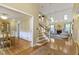 Open floor plan featuring a dining room, staircase, and a spacious living room with fireplace at 8723 Bergeson Dr, Indianapolis, IN 46278