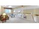 Loft featuring a sitting area, neutral decor, and a view of the lower level at 8723 Bergeson Dr, Indianapolis, IN 46278