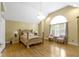 Grand main bedroom features vaulted ceilings, large window, and a decorative chandelier at 8723 Bergeson Dr, Indianapolis, IN 46278
