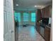Cozy kitchen featuring dark cabinets, stainless steel appliances, and a view of the breakfast nook at 8810 Summer Walk E Dr, Indianapolis, IN 46227