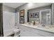 Bathroom featuring a double vanity, quartz counters, and shower-tub combo at 8838 Alexander Ridge Dr, McCordsville, IN 46055