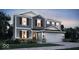 Charming two-story home with gray siding, a two-car garage, and professional landscaping at 8838 Alexander Ridge Dr, McCordsville, IN 46055