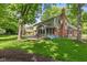 Spacious backyard with a concrete patio and screened-in porch offering outdoor enjoyment at 8934 Pinyon Ct, Indianapolis, IN 46260