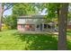 Backyard with a spacious patio perfect for outdoor living, adjacent to screened-in porch at 8934 Pinyon Ct, Indianapolis, IN 46260