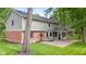 Back of home with patio and screened porch overlooks beautiful landscaped backyard at 8934 Pinyon Ct, Indianapolis, IN 46260