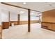 Finished basement area with wood accents, carpeting, and ample space at 8934 Pinyon Ct, Indianapolis, IN 46260