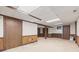 Spacious finished basement area featuring paneled walls and neutral carpeting at 8934 Pinyon Ct, Indianapolis, IN 46260