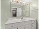 Vanity featuring a large mirror and bright lighting at 8934 Pinyon Ct, Indianapolis, IN 46260
