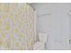 This bathroom offers a floral curtain and toilet at 8934 Pinyon Ct, Indianapolis, IN 46260