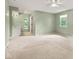Bright bedroom with neutral walls, a ceiling fan, and an en suite vanity and mirror at 8934 Pinyon Ct, Indianapolis, IN 46260
