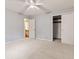 This bedroom provides ample space with neutral walls and carpet at 8934 Pinyon Ct, Indianapolis, IN 46260