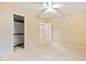 This bedroom offers ample space with neutral walls and carpet at 8934 Pinyon Ct, Indianapolis, IN 46260