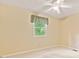 The bedroom features tan walls and a bright window at 8934 Pinyon Ct, Indianapolis, IN 46260