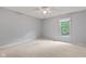 A bright bedroom with carpet and featuring a ceiling fan and window at 8934 Pinyon Ct, Indianapolis, IN 46260