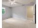 This bedroom is spacious with neutral walls and carpet at 8934 Pinyon Ct, Indianapolis, IN 46260